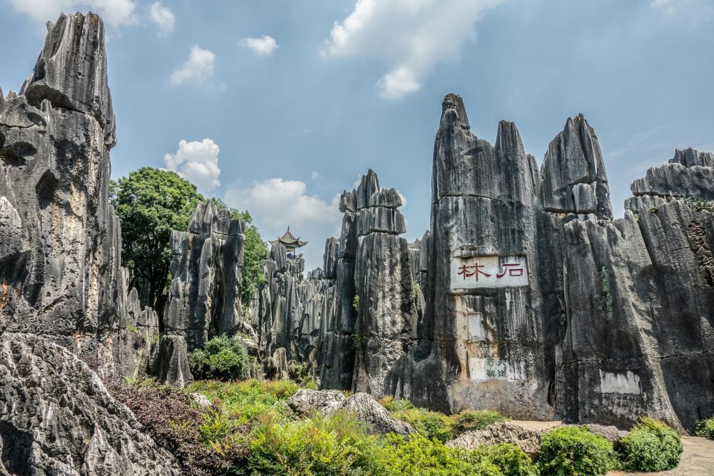 Discover the majestic limestone formations of the Stone Forest in Kunming, China, a UNESCO World Heritage site.